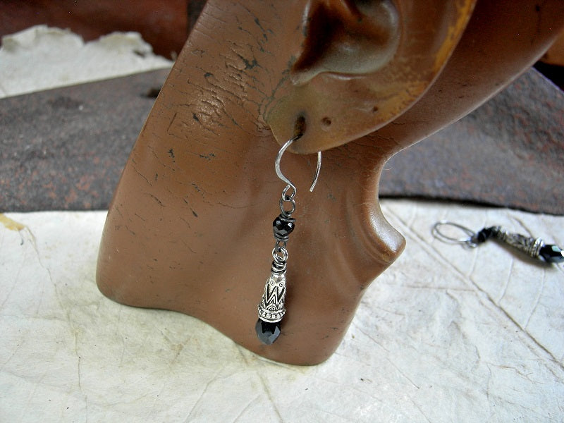Sleek black & silver drop earrings with faceted tourmaline cubes, ornate silver cone caps & silvery black crystal teardrops. 