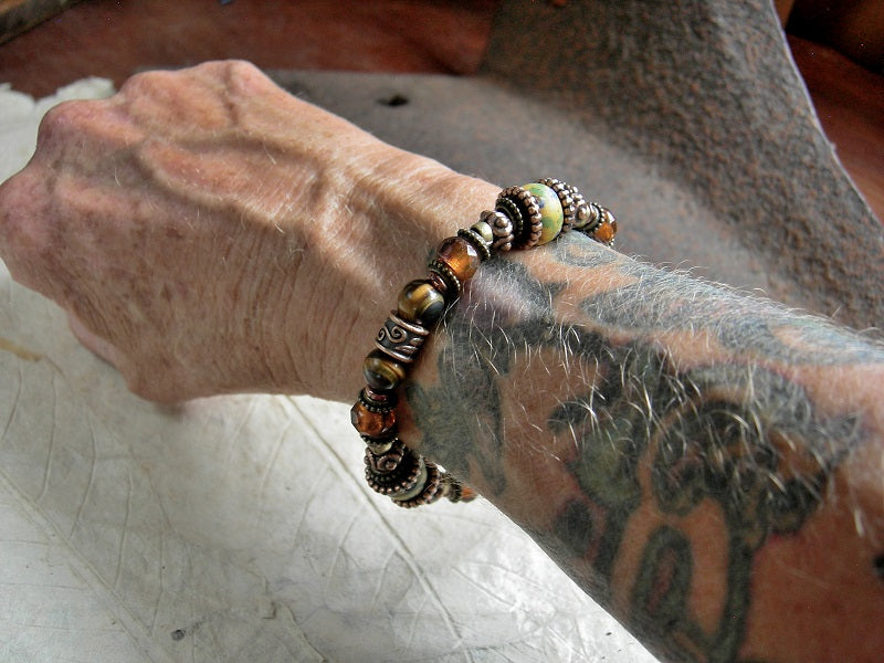 Warm color adjustable slider bracelet with antique Venetian glass, tiger eye, amber-orange faceted Czech glass & copper.