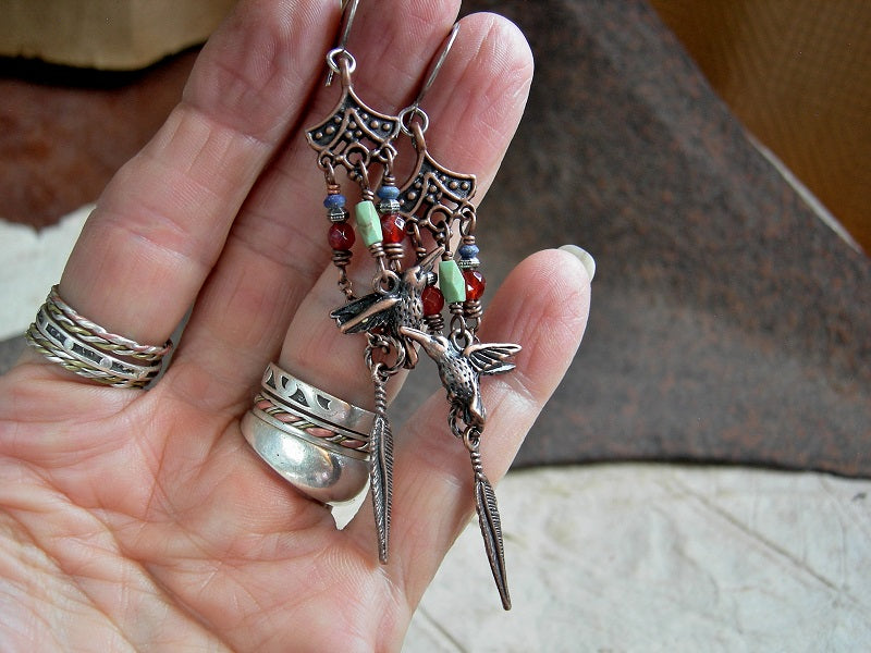 Long chandelier style earrings with colorful gemstone beads, copper hummingbird & feather charms, sterling ear wires.