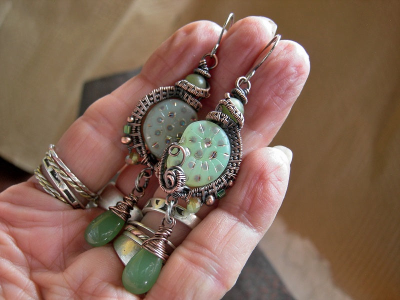 Unusual peacock spot green nautilus earrings with oxidized copper wire wrap, jade beads & green glass tear drops.