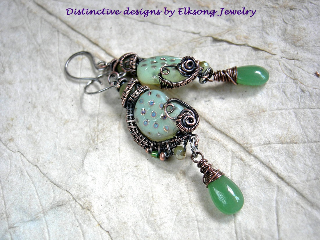 Luminous green nautilus earrings with oxidized copper wire wrap, jade beads & green glass tear drops.