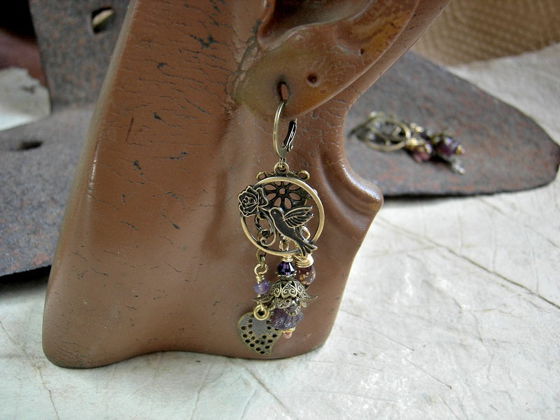 Hummingbirds in Lilacs chandelier earrings with antiqued brass charms, purple glass flowers & teardrops, Swarovski crystals.