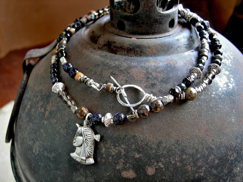 Triple wrap bracelet/necklace with vintage sterling Egyptian charm, silver finish beads & caps, black & brown gemstone beads.