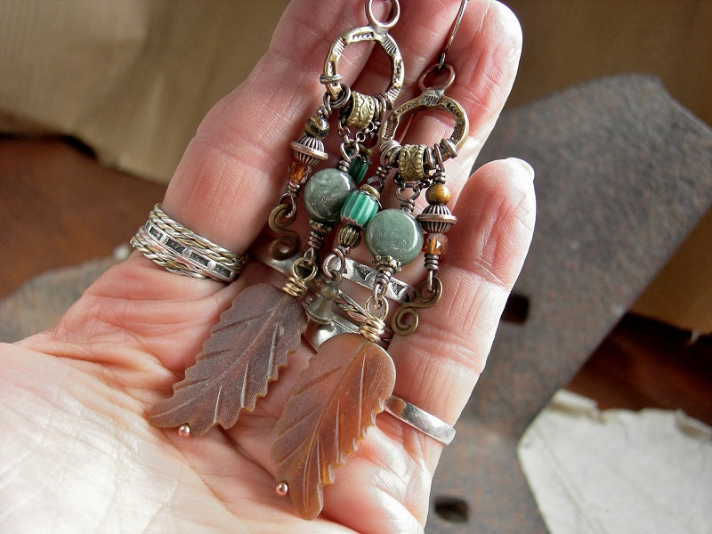 Chandelier style statement earrings with green & orange gemstone, carved horn, vintage African glass & handmade stamped brass rings.