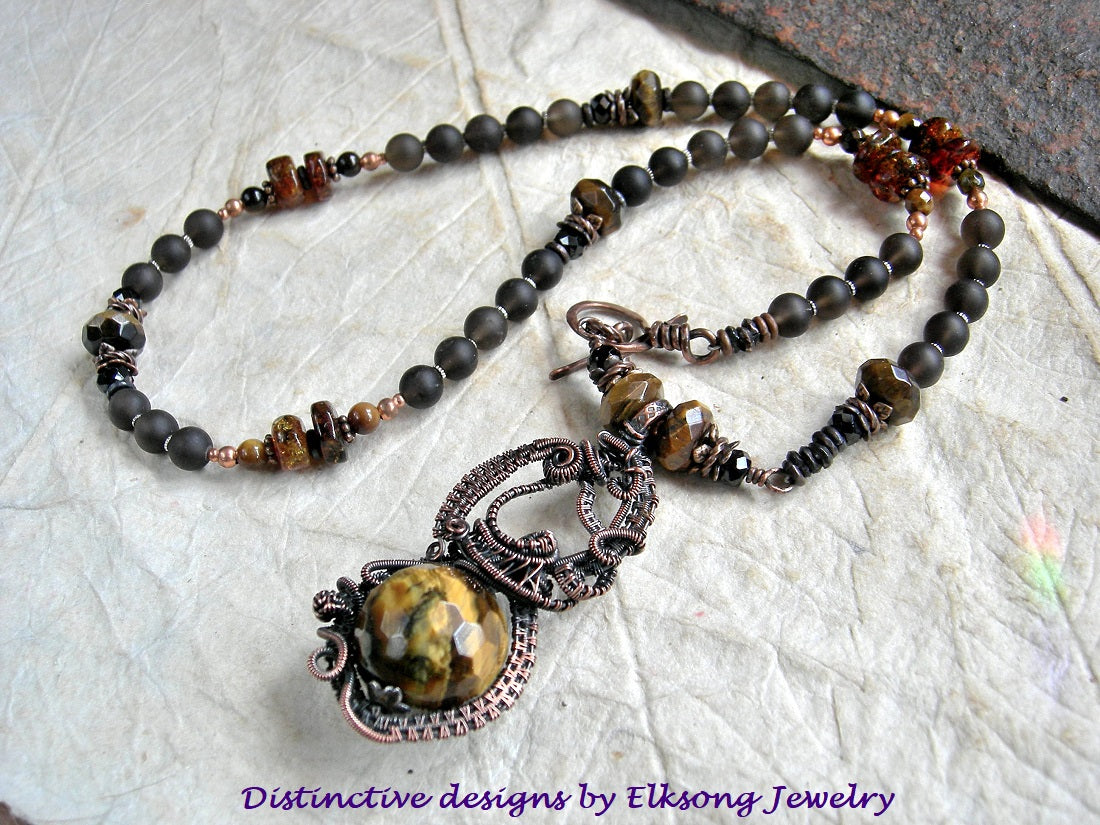 Tiger eye & copper wire wrap art necklace, with ornate focal & strung smoky quartz, tiger eye, black tourmaline & amber beads.