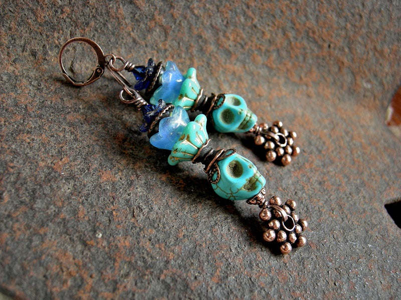 Sugar skull earrings, Dia de los Muertos style, with turquoise magnesite skull beads, glass flowers & copper.