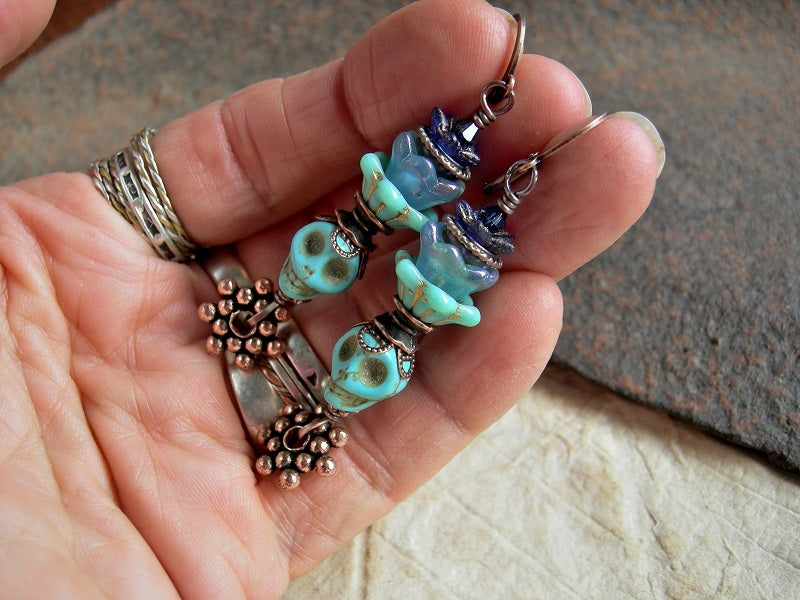 Shades of blue sugar skull earrings, Dia de los Muertos style, glass flowers & copper.