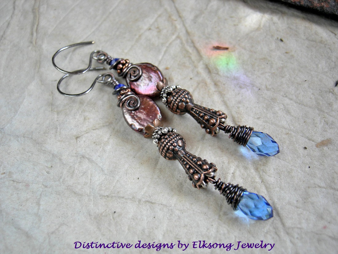 Copper Scepter earrings with faceted lapis, copper iridescent freshwater pearl ovals, faceted blue crystal teardrops, copper & silver Bali style caps.