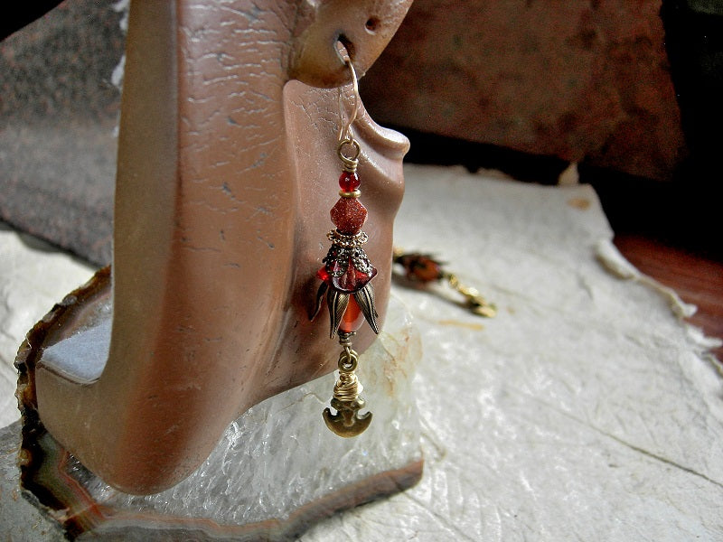 Sunset color earrings with carnelian, goldstone, glass flowers, antiqued brass caps & vintage ethnic brass crescent charms. 14kt gold filled ear wires.
