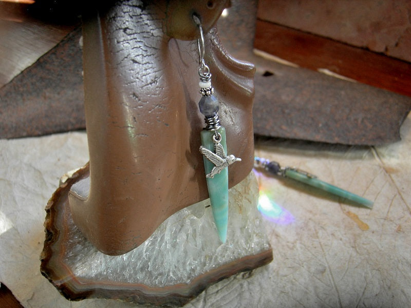 Boho luxe earrings with blue amazonite dagger tabs, silver hummingbird charms, faceted gray blue iolite, white magnesite & handmade sterling ear wires.