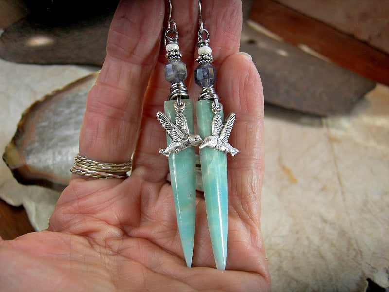 Dagger shaped amazonite stone tab earrings with silver hummingbird charms, faceted gray blue iolite, white magnesite & handmade sterling ear wires.