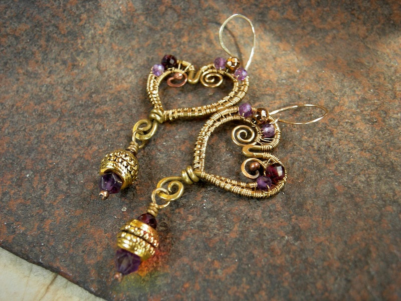 Abstract heart shaped golden brass wire wrap earrings with faceted amethyst, garnet & golden hematite. 14kt gold fill ear wires.