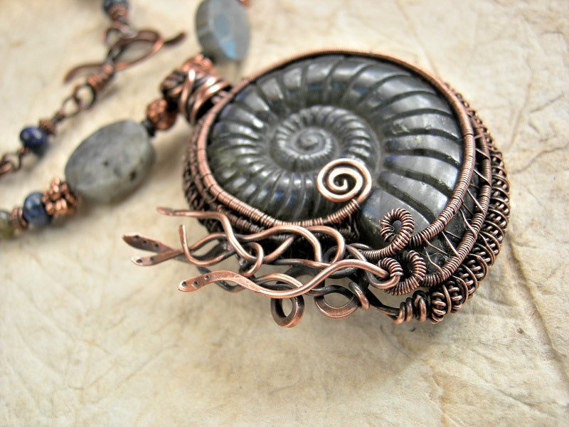 Necklace focal of carved labradorite nautilus & copper wire wrap focal, copper, lapis & labradorite beads.