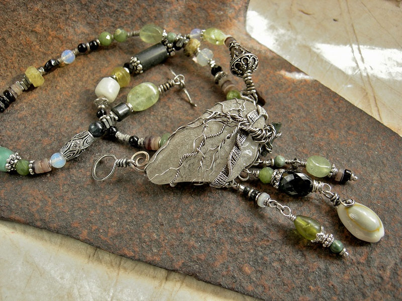 Sterling wire wrap tree on sea glass, strung bead necklace with jade, prehnite, green garnet, black tourmaline & silver beads.