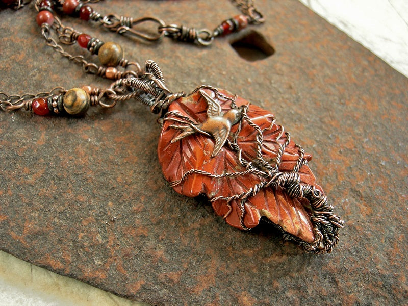 Red jasper leaf & copper wire wrap tree & swallow focal on necklace of double copper chain, carnelian & jasper beads.