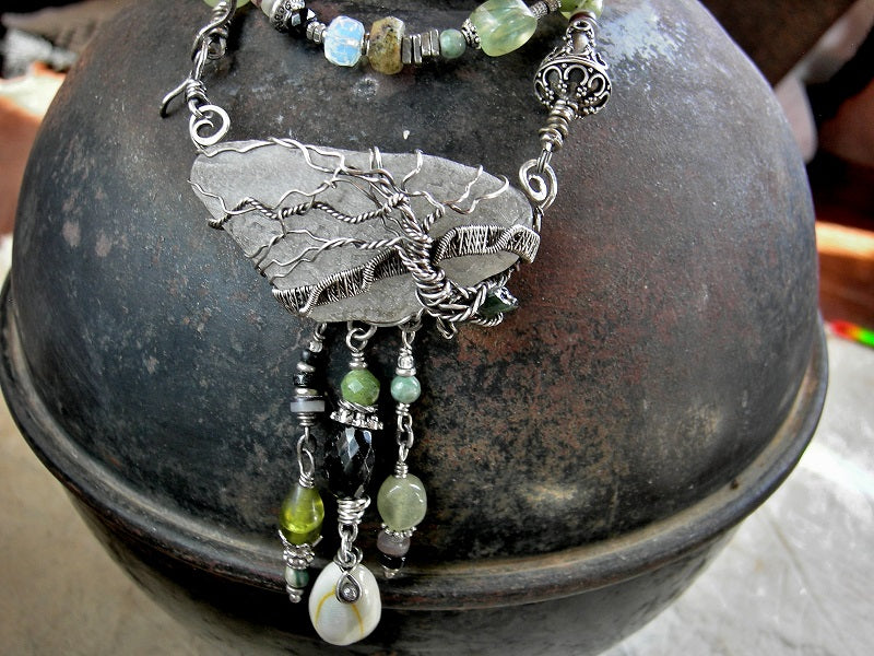Sterling wire wrap tree on sea glass, strung bead statement necklace with jade, prehnite, green garnet, black tourmaline & silver beads.