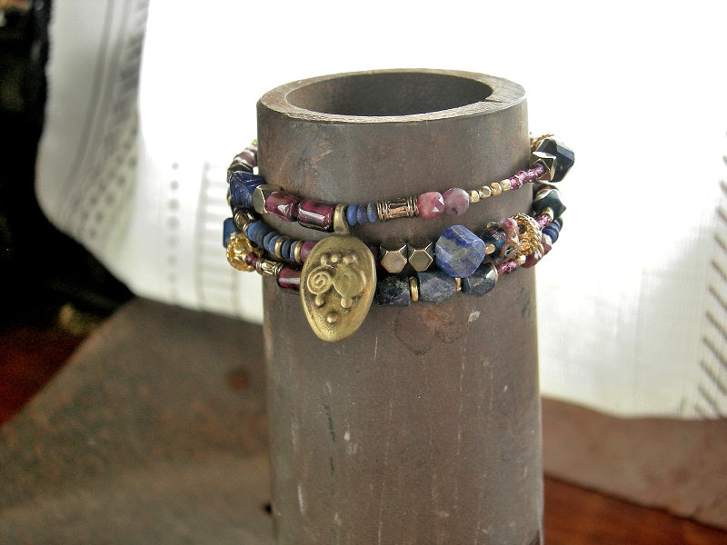 Triple wrap bracelet or necklace with various lapis, garnet, ruby & 22kt gold-over-copper beads.