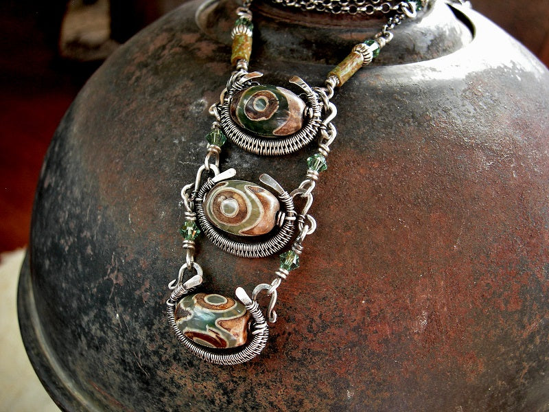 Earthy green/brown Tibetan agate & silver pendant with sterling wire wrap, green Swarovski crystals & sterling chain.