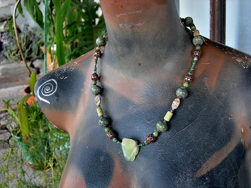 Tree frog necklace, strung bead style with hand carved pale green serpentine frog focal, serpentine, jade, malachite, jasper & copper beads. Copper toggle clasp.