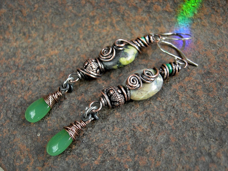Earthy boho earrings with shaded serpentine ovals & oxidized copper wire wrap, malachite, copper beads & jade green glass tear drops.