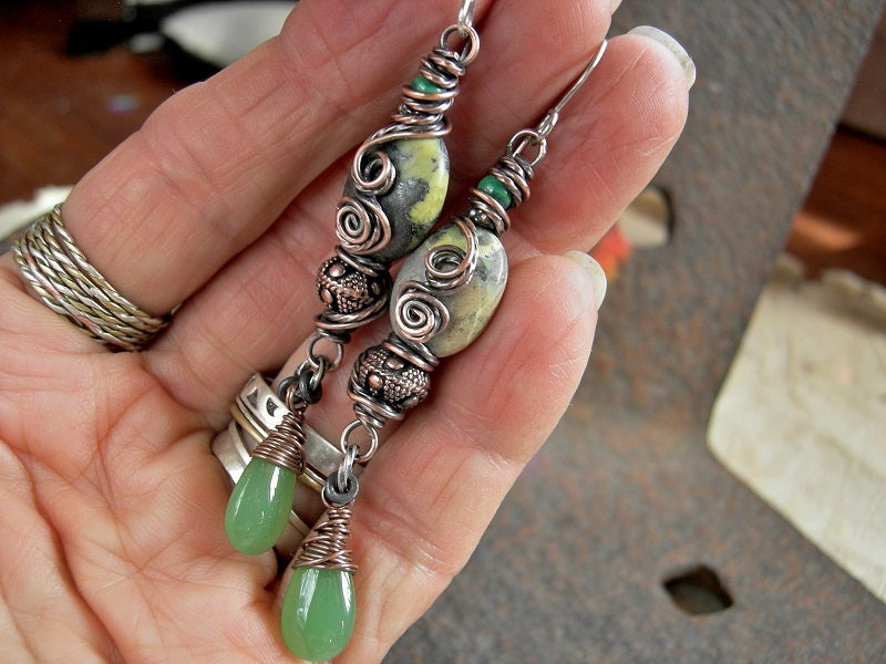 Copper wire wrap earrings with green & black serpentine ovals , malachite, copper beads & jade green glass tear drops.