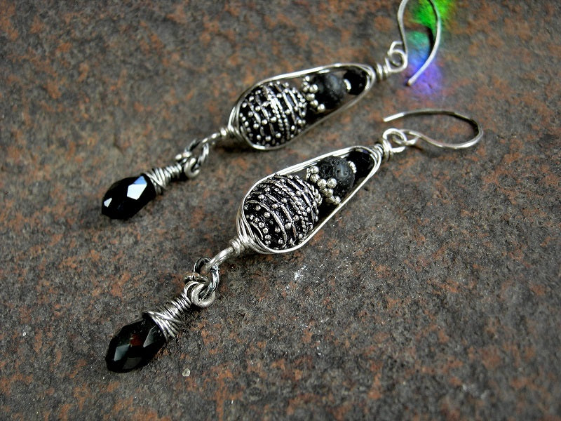 Boho luxe wire wrap earrings with sterling-over-copper Bali style beads & black gemstone in sterling pea pod wire wrap. Black crystal tear drops.