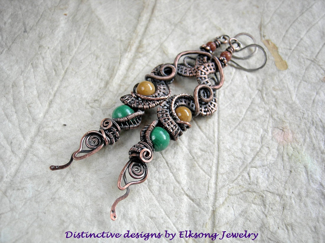 Copper wire wrap Dragontail earrings with malachite, golden jade & goldstone rounds. Handmade sterling ear wires.