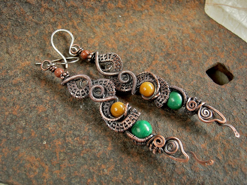 Dragontail earrings with oxidized copper wire wrap, malachite, golden jade & goldstone beads. Handmade sterling ear wires.