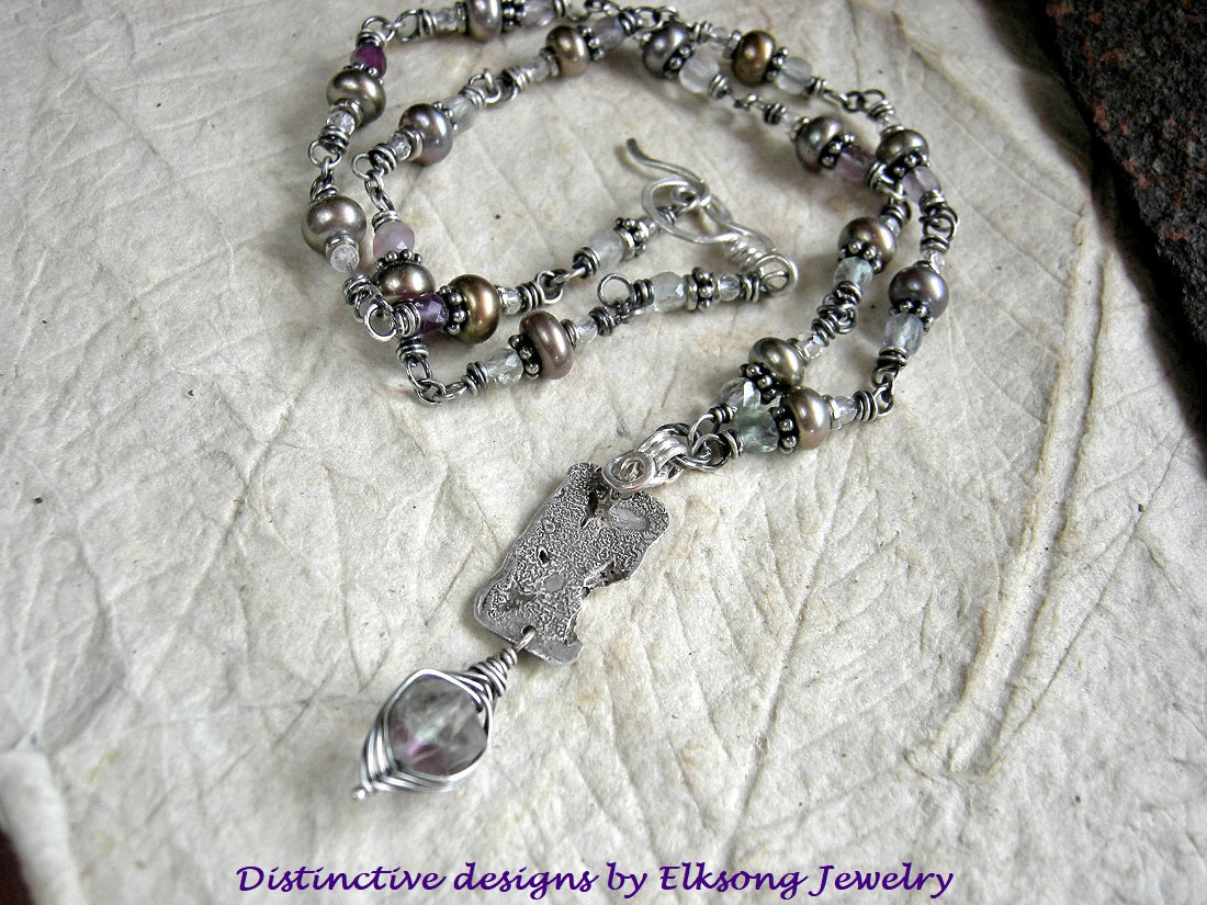 Sterling silver wrapped link necklace with reticulated sterling focal and fluorite, crystal & freshwater pearl beads. Sterling toggle clasp.