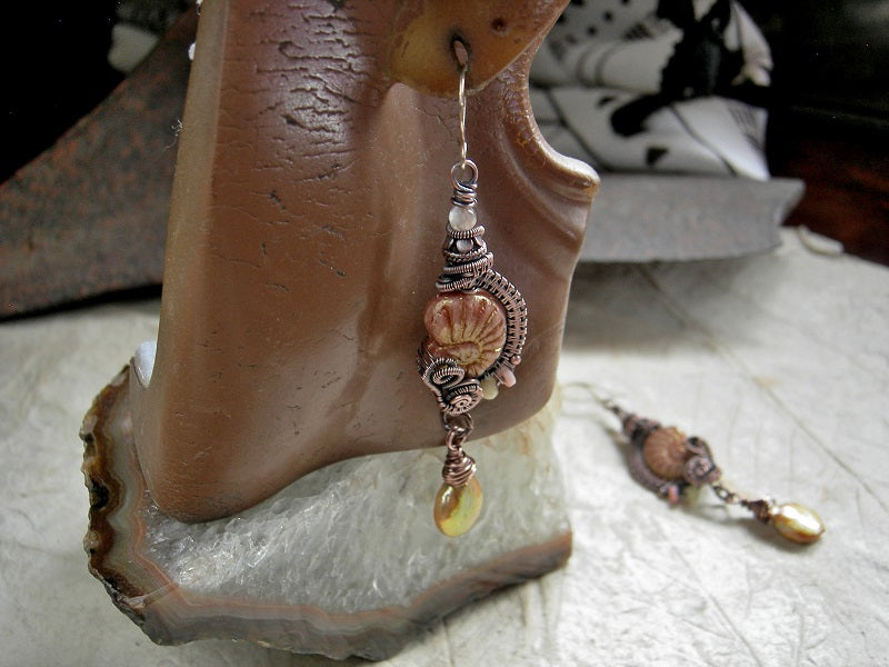 Pinkish gold glass nautilus & copper wire wrap earrings with gold coin pearls, yellow opal, pink coral & sunstone, copper Bali beads, 14kt gold filled ear wires.