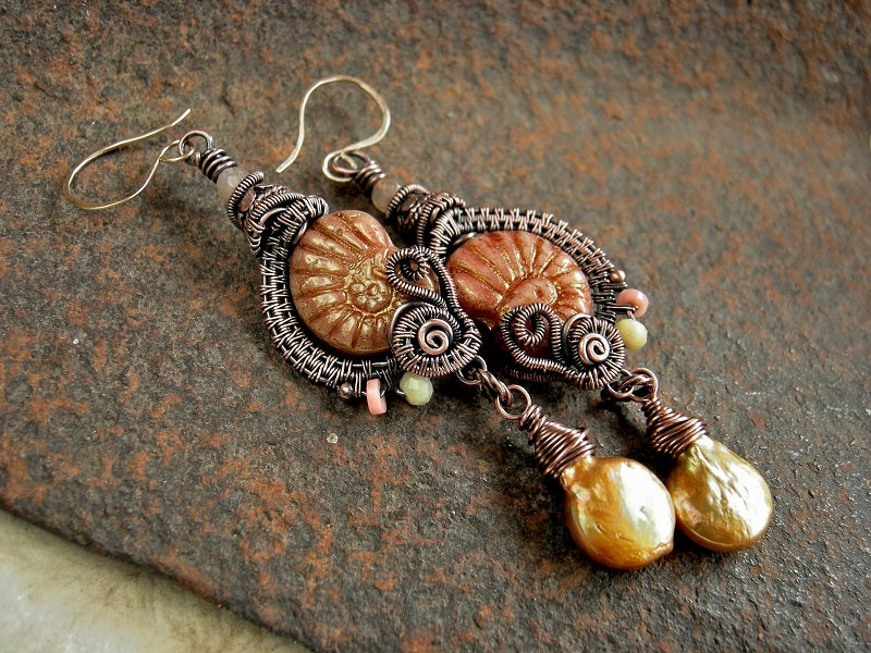 Pressed glass nautilus earrings with copper wire wrap gold coin pearls, yellow opal, pink coral & sunstone, copper Bali beads, 14kt gold filled ear wires.