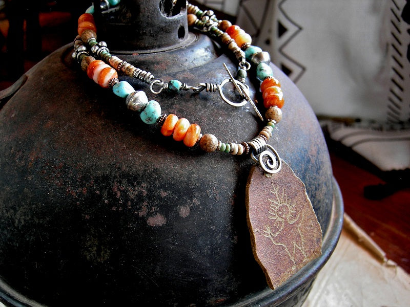 Earthy orange/brown/turquoise necklace with Petroglyph focal, strung turquoise, spiny oyster shell, picture jasper & sterling silver beads.