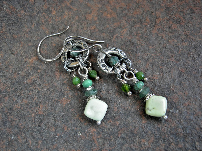 Chandelier style earrings with stamped silver rings, green gemstone mix, ancient Roman glass discs, sterling ear wires.