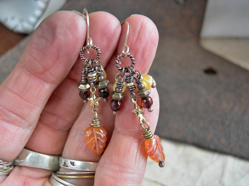 Colorful boho earrings with golden & dark cognac amber beads, leaf shaped carved carnelian beads, golden stars & 14kt gold filled ear wires.