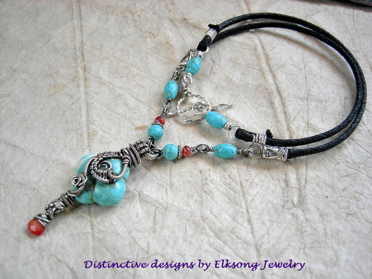 Boho turquoise necklace with colored magnesite & sterling wire wrap focal & beads, spiny oyster & coral beads and drop, silver finish caps, woven black cord.