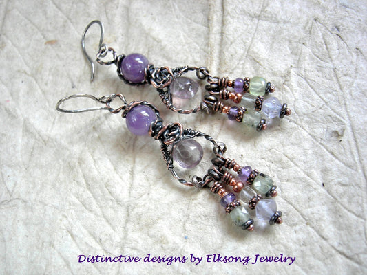 Twisted copper looped chandelier earrings with purple & green gemstone and sterling ear wires.