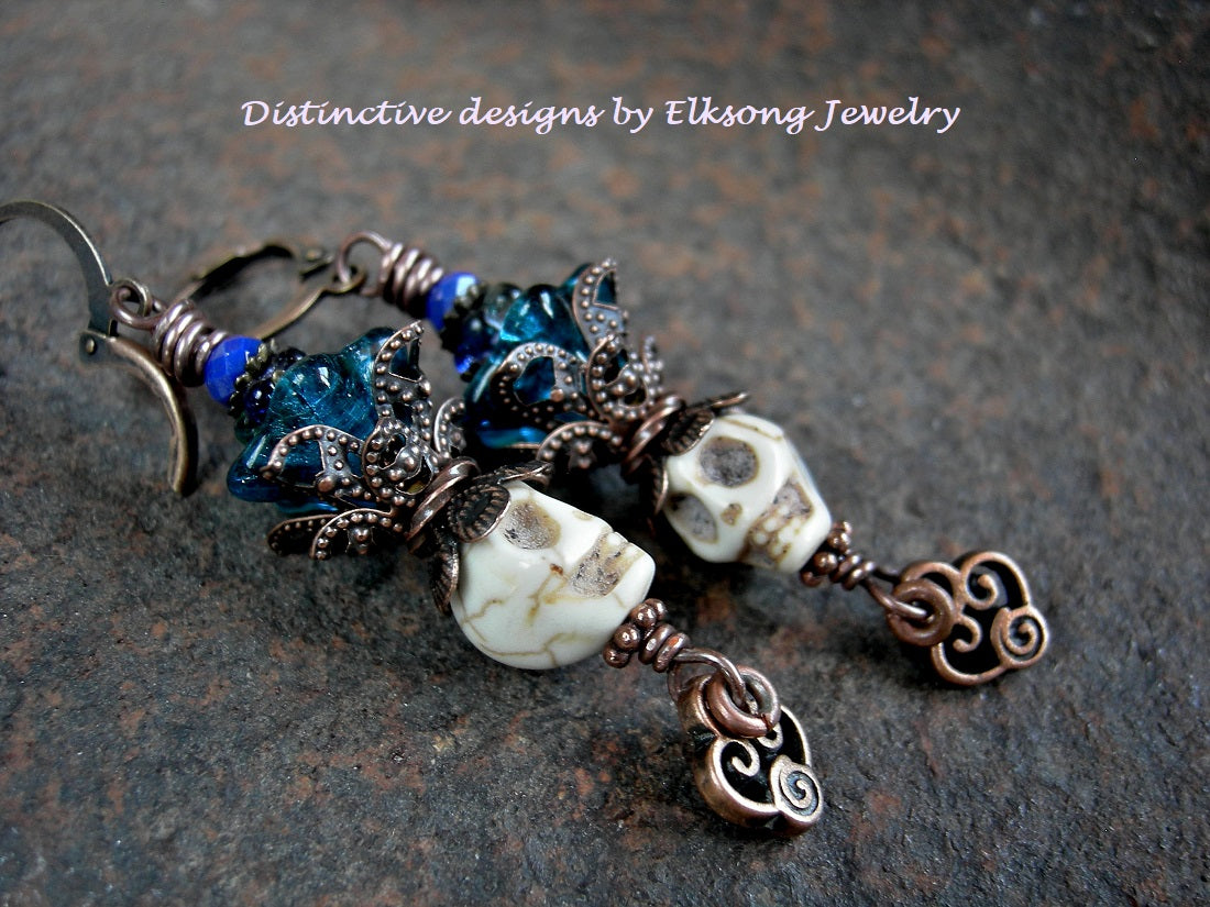Ivory sugar skull earrings with teal glass flowers. Natural magnesite beads, antiqued copper details.