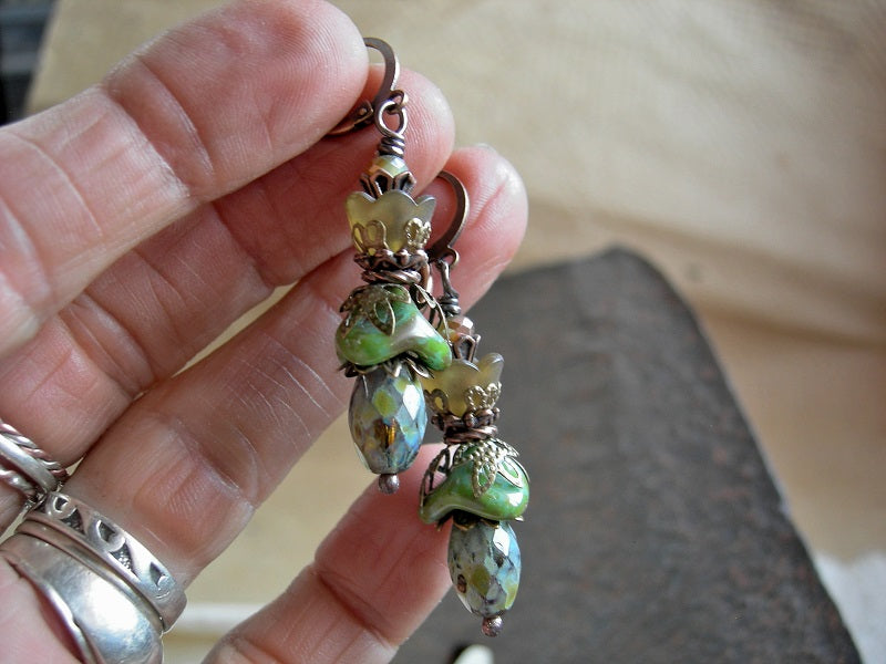 Boho chic flower earrings with green & brown glass & resin flowers, faceted glass beads & antiqued copper & brass details.