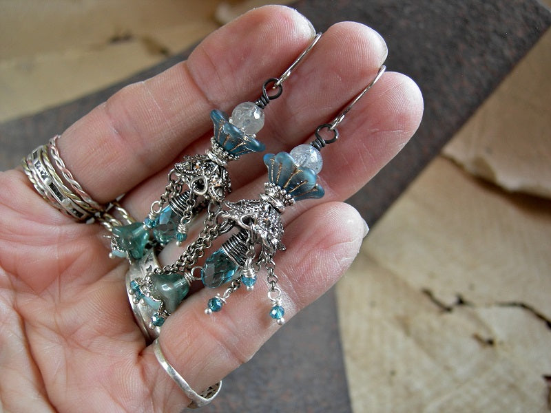 Asymmetrical silver, crystal, gemstone & flower chandelier earrings with glass flowers, faceted aquamarine & crystal rondelles & tear drops.