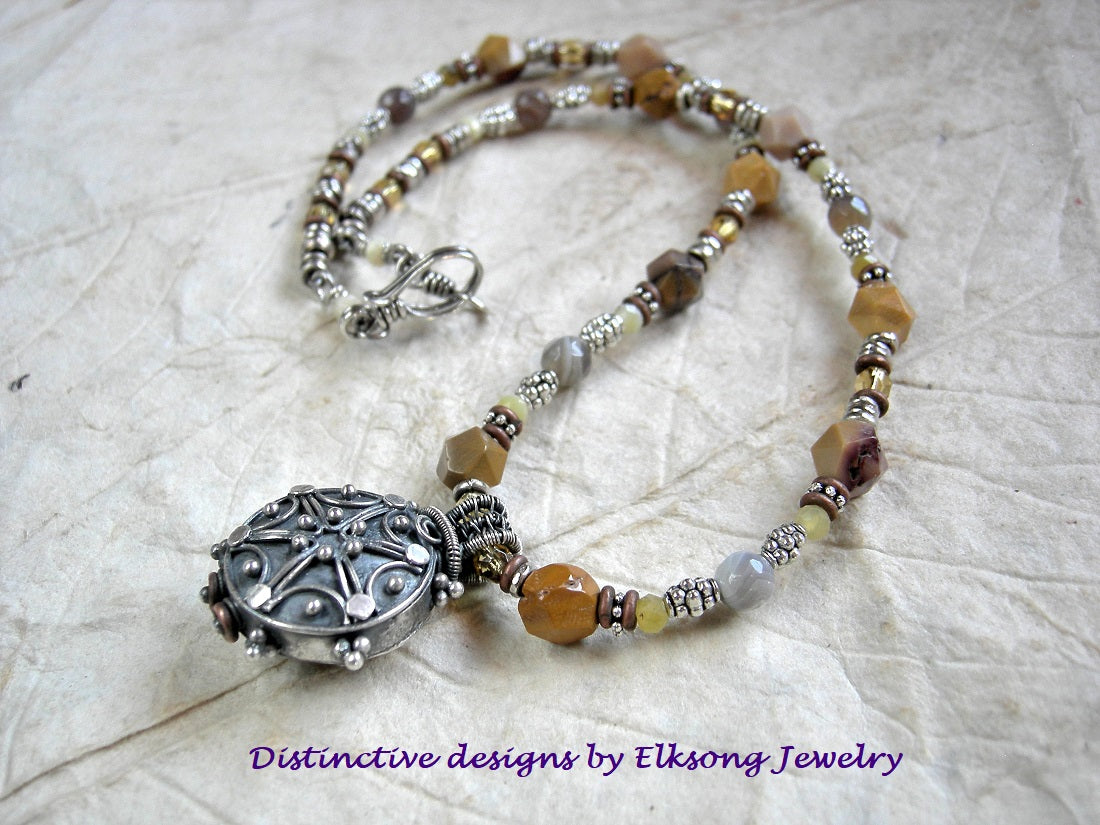 Butterscotch colors in this strung yellow gemstone bead & vintage Bali silverwork focal necklace.