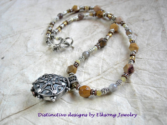 Butterscotch colors in this strung yellow gemstone bead & vintage Bali silverwork focal necklace.