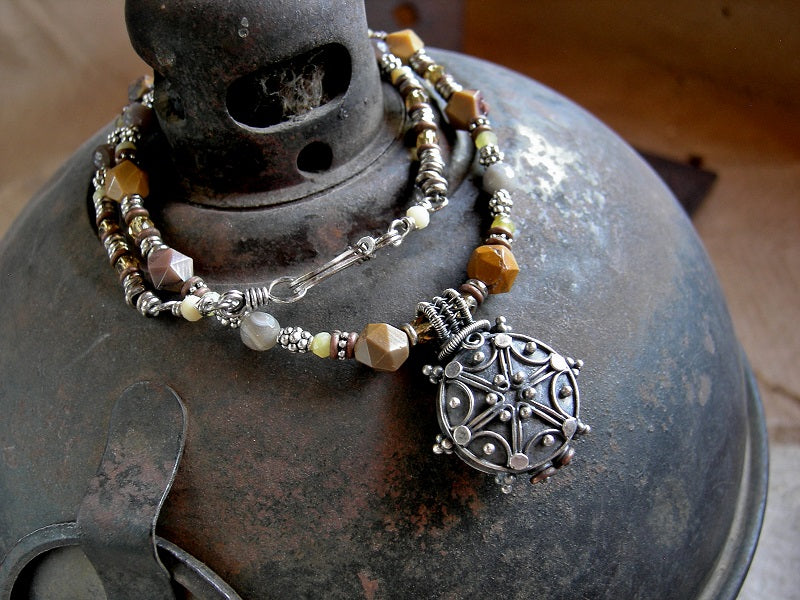 Earthy boho bead necklace with faceted yellow gemstone, silver Bali focal, silver & copper heishi & hook and eye clasp.