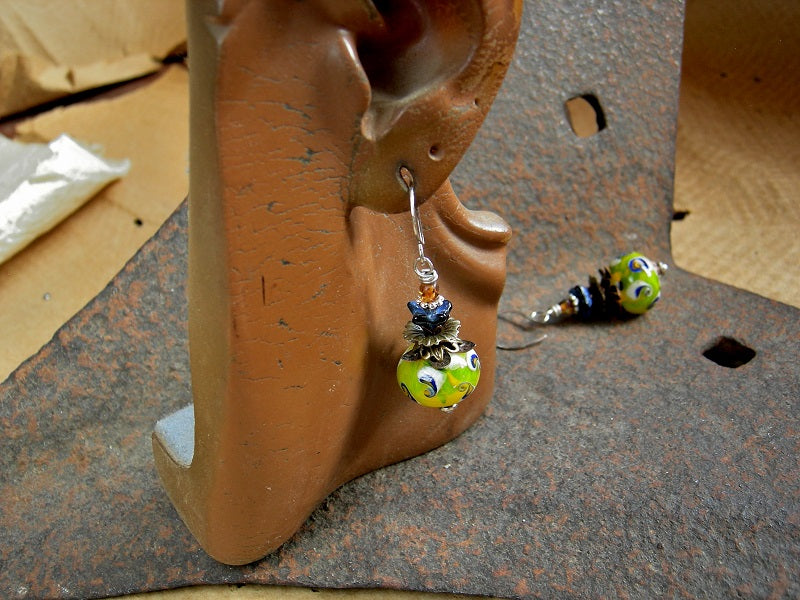 Colorful boho funky earrings of studio made lampwork glass in acid yellow, deep blue & cream. Glass flowers & faceted glass beads.