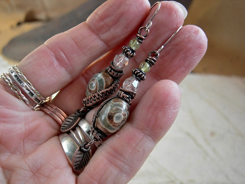Tibetan etched agate earrings with faceted quartz crystal, peridot & copper wire wrap.