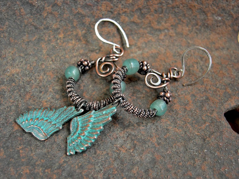 Coiled copper wire wrap hoop earrings with aqua Java glass & copper beads, verdigris copper wing charms.