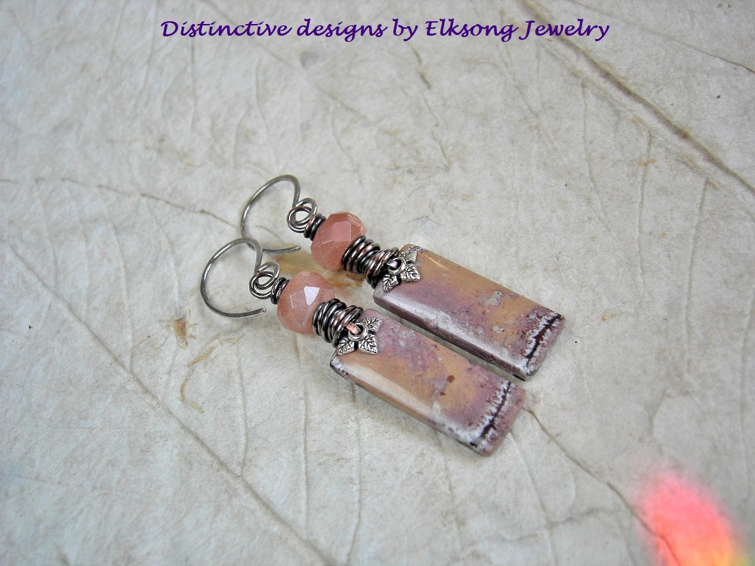 Adobe Sands earrings, hand cut Mexican rhyolite stone tabs in soft pink orange & brick, faceted sunstone & copper wire wrap.