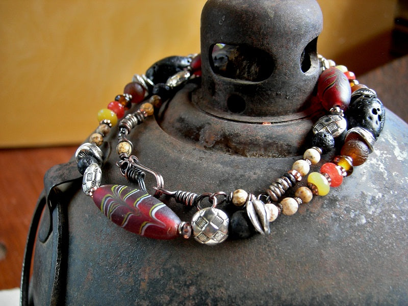 Earthy elegant necklace with vintage glass "feather" beads, lava stone, picture jasper, carnelian. Black, amber, russet colors.