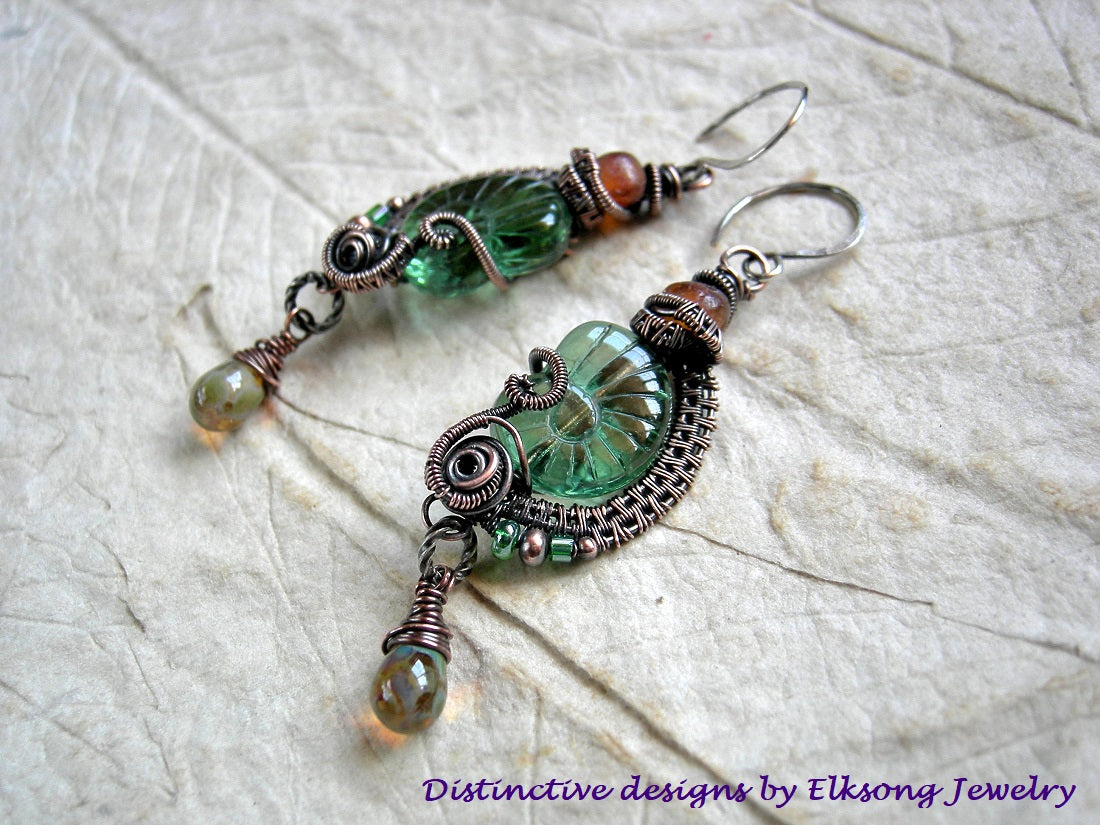 Sea green & amber nautilus earrings with Czech glass beads, natural Baltic amber & oxidized copper wire wrap.