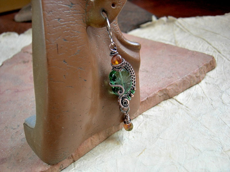 Sea green & amber nautilus earrings with transparent Czech glass beads, natural Baltic amber & oxidized copper wire wrap.
