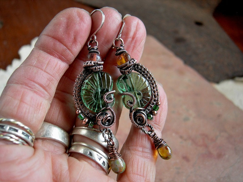 Green nautilus earrings with pressed Czech glass beads, natural Baltic amber & oxidized copper wire wrap.